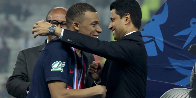 LILLE, FRANCE - MAY 25: Kylian Mbappe of PSG salutes PSG President Nasser Al Khelaifi during the podium ceremony following the French Cup Final between Olympique Lyonnais (OL, Lyon) and Paris Saint-Germain (PSG) at Stade Pierre Mauroy, Decathlon Arena on May 25, 2024 in Villeneuve d'Ascq near Lille, France. (Photo by Jean Catuffe/Getty Images)